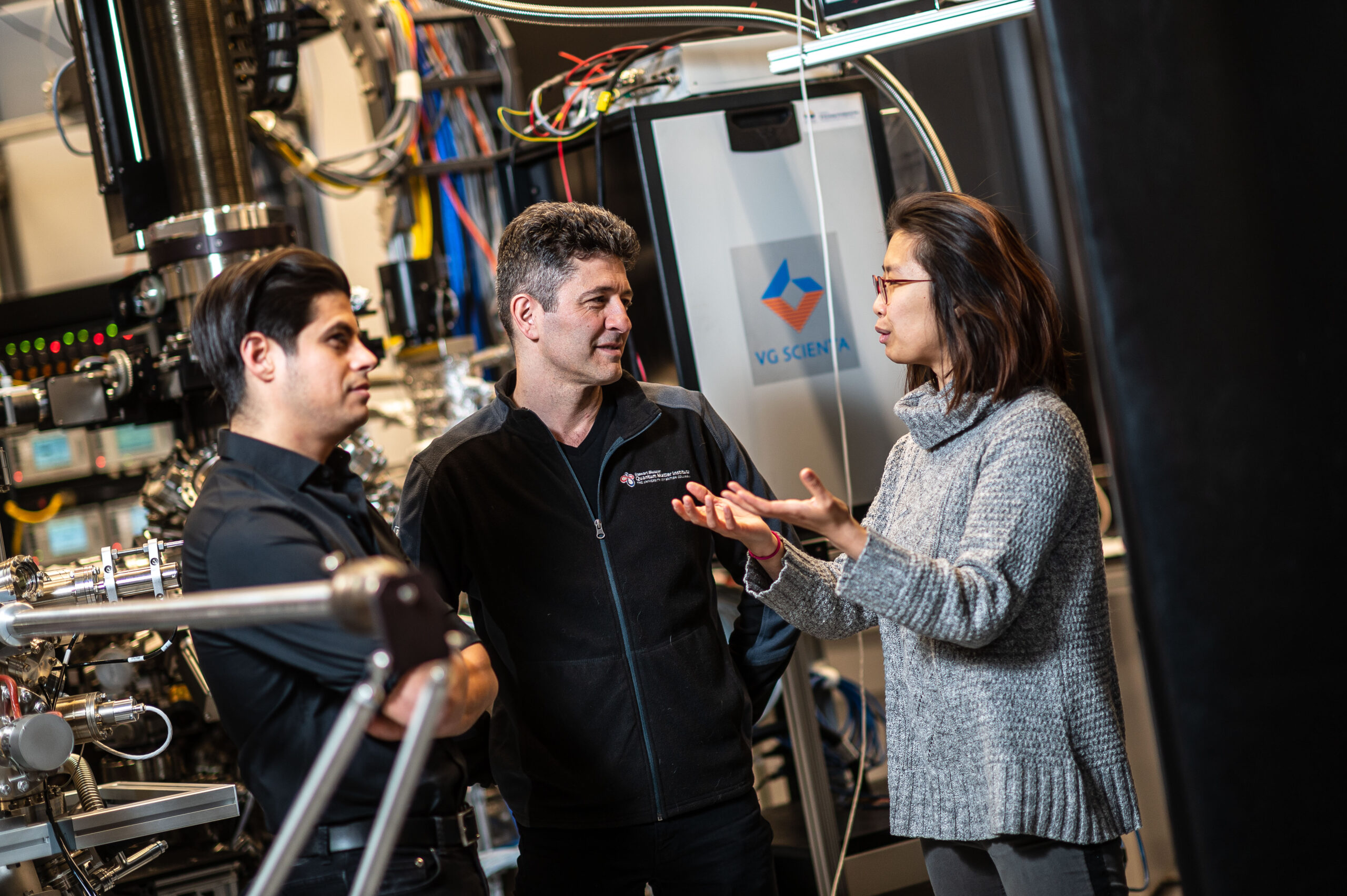 Damscelli lab researchers discussing an experiment in the TR-ARPES lab.